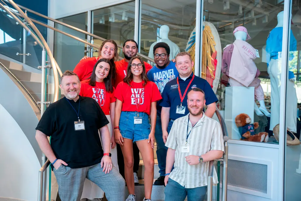 Photo of alumni and current orientation students on stairwell