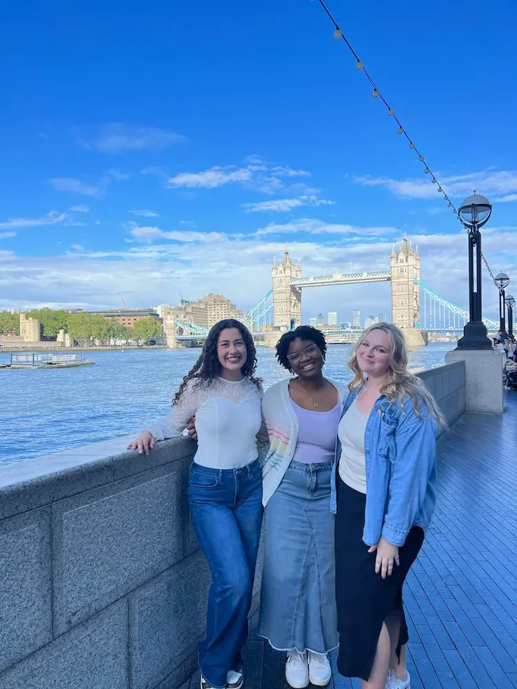 students pose in front of London Tower