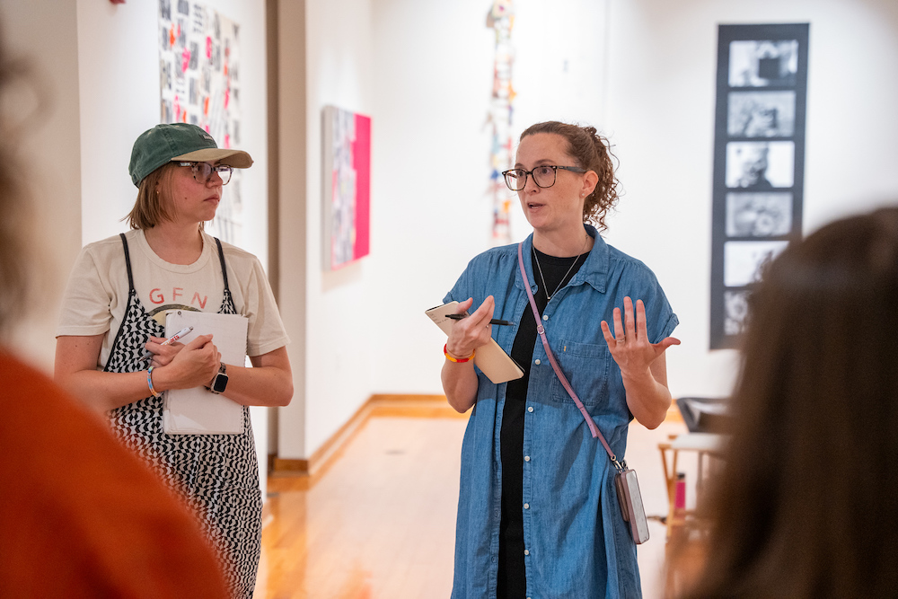 woman talking at an art critique