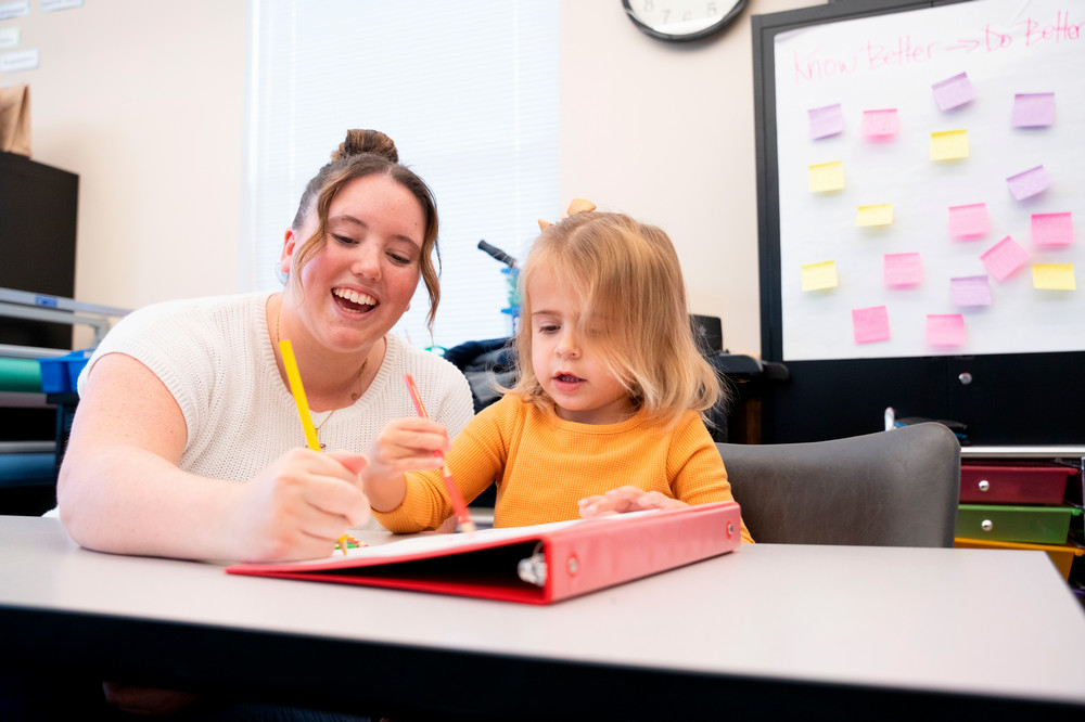 Teacher helping a child