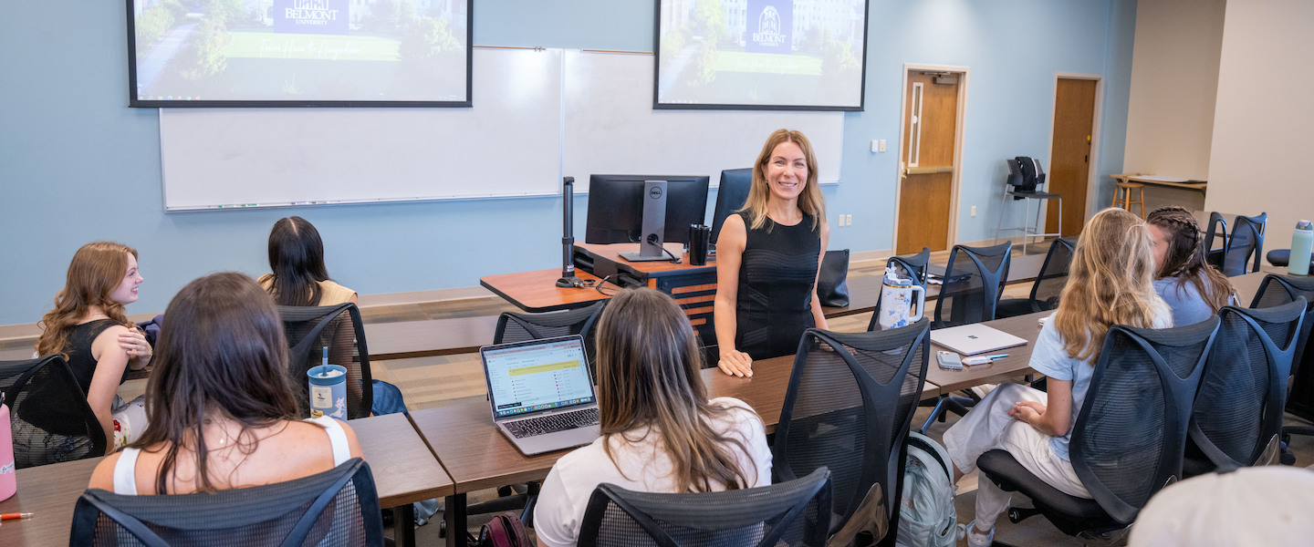 Professor teaching business students in class