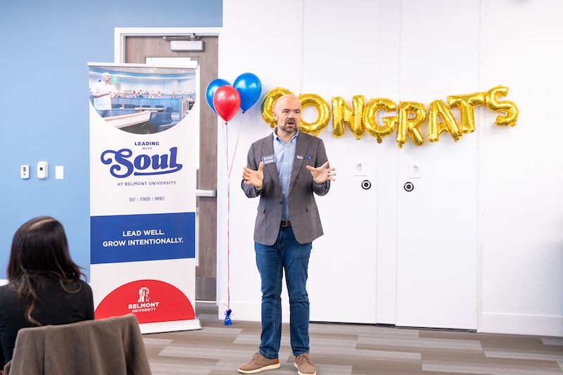 Dr. Jeremy Fyke speaks to ELDP participants in front of a “Leading with SOUL” banner.