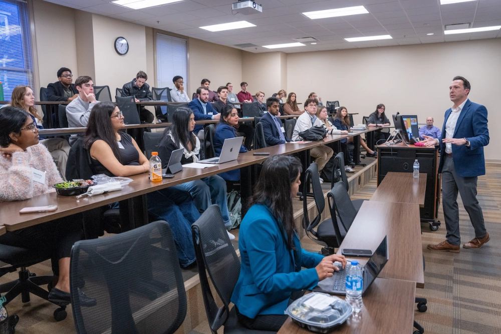 Classroom filled with students and a presenter