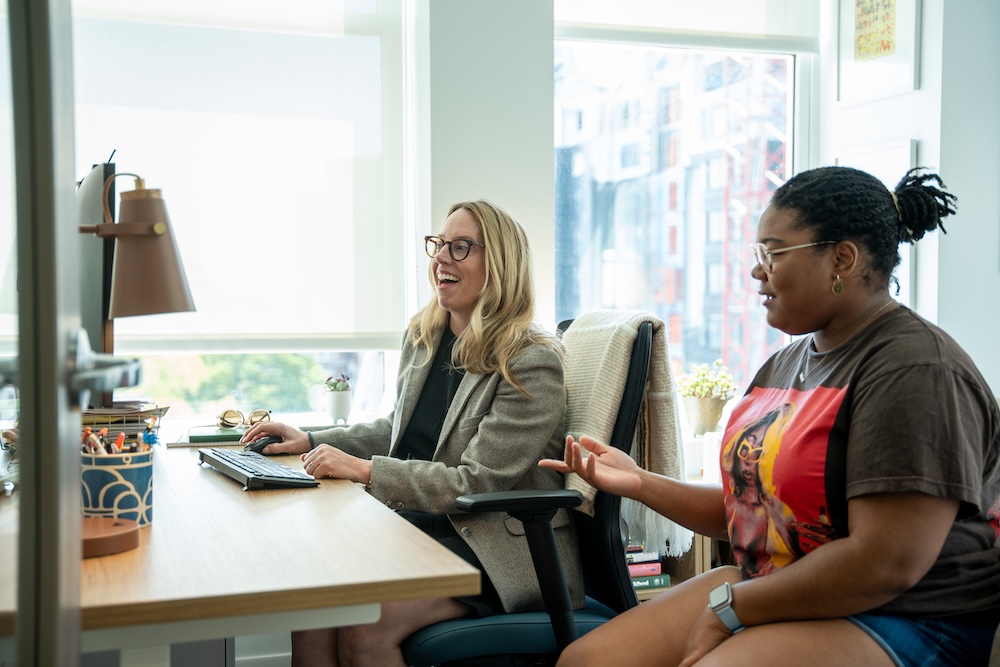 Dr. Jennifer Crowell-Thompson and student look at a computer