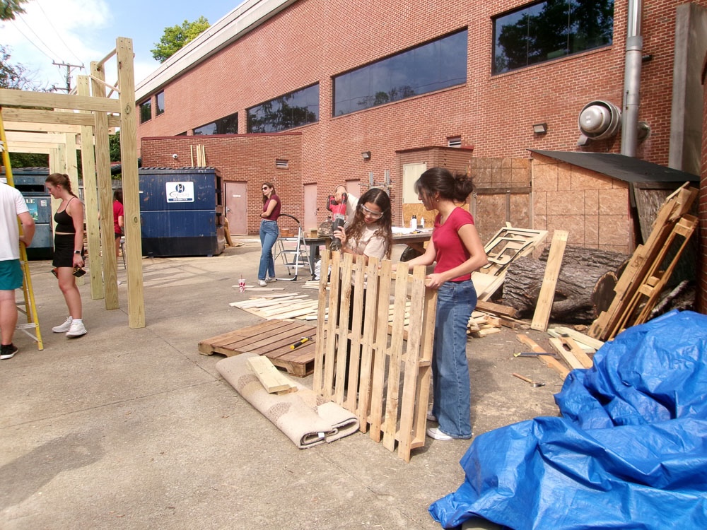 students smile from construction day