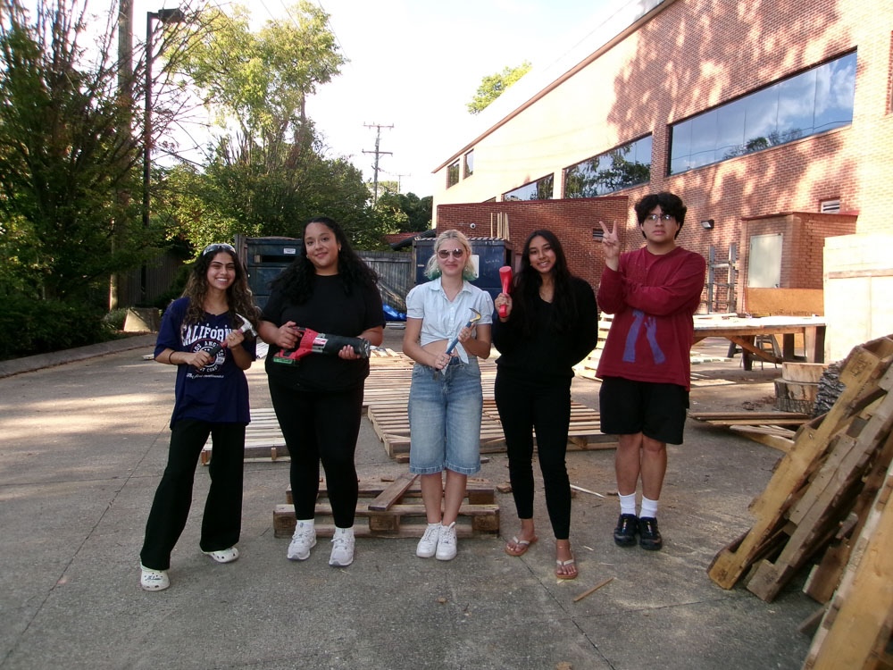 students smile from construction day