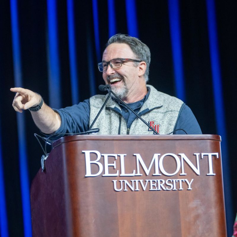 Sam Simpkins speaks at podium