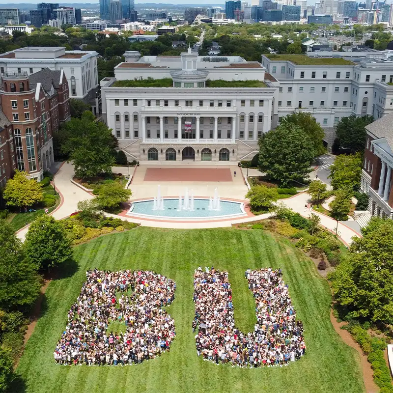 Drone shot of campus with students forming the letters BU