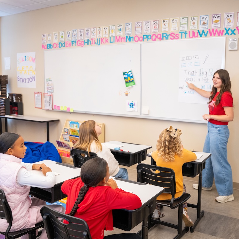 Belmont student teaching children in class