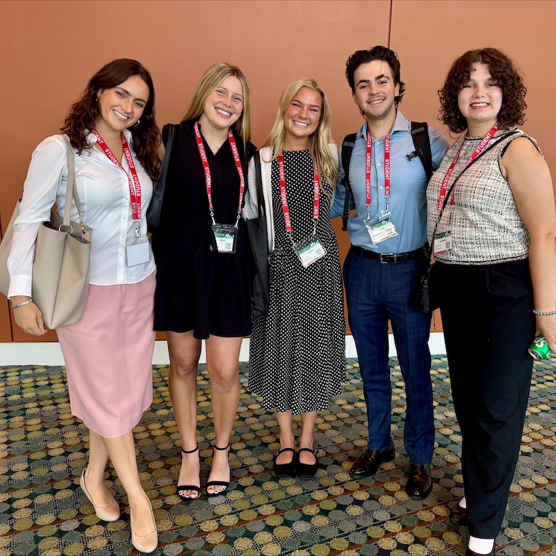 Five Belmont students at a conference