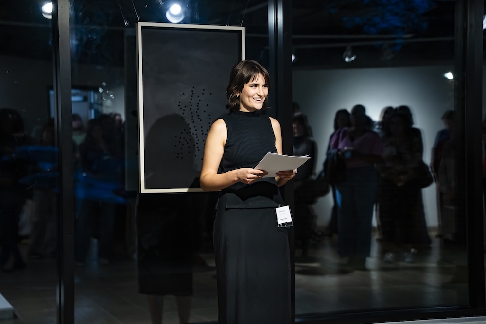 Nichols talking at gallery reception