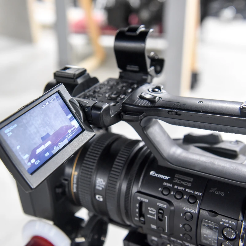A cinema camera wth its screen folded out