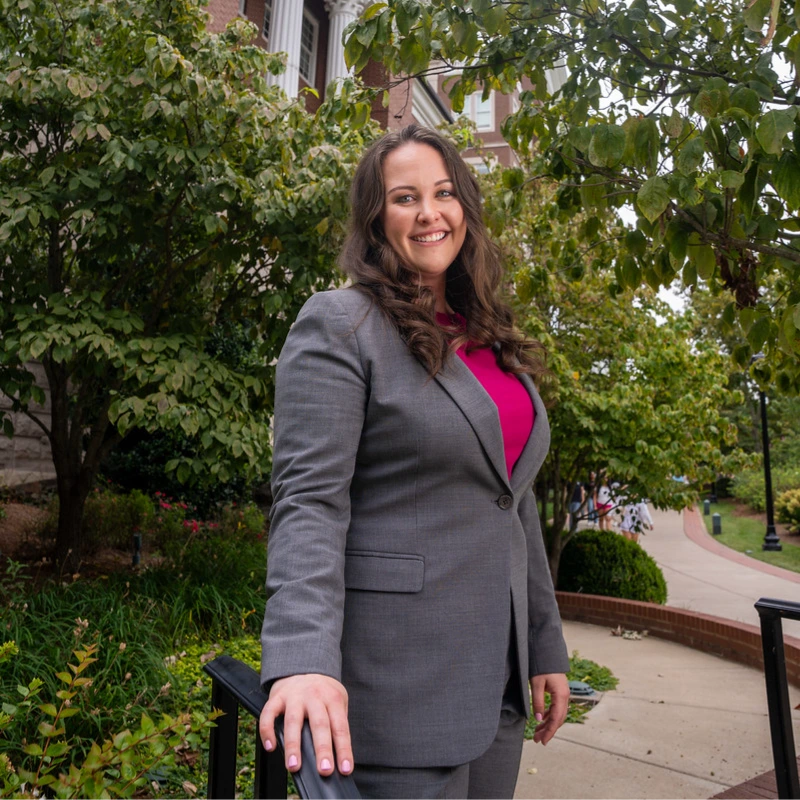 Samantha McCaleb poses in front of Baskin Hall