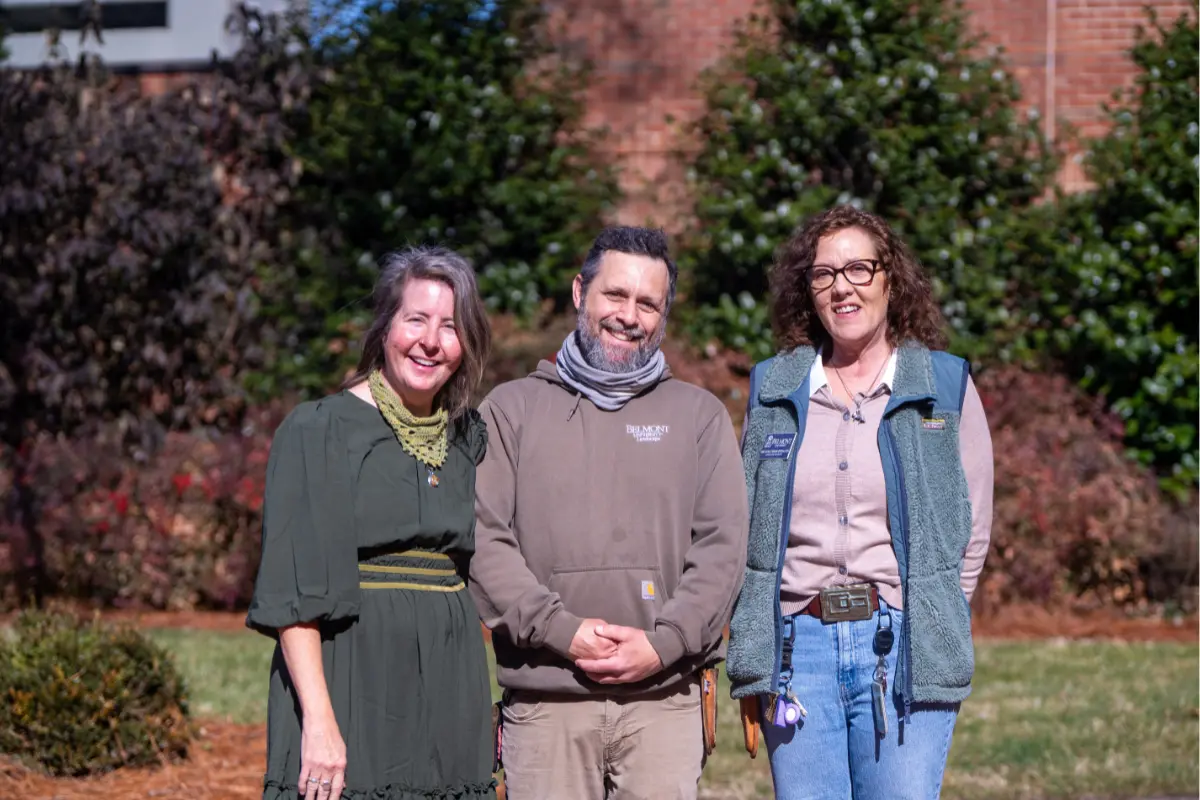 Dana Stein with two Belmont landscaping employees 