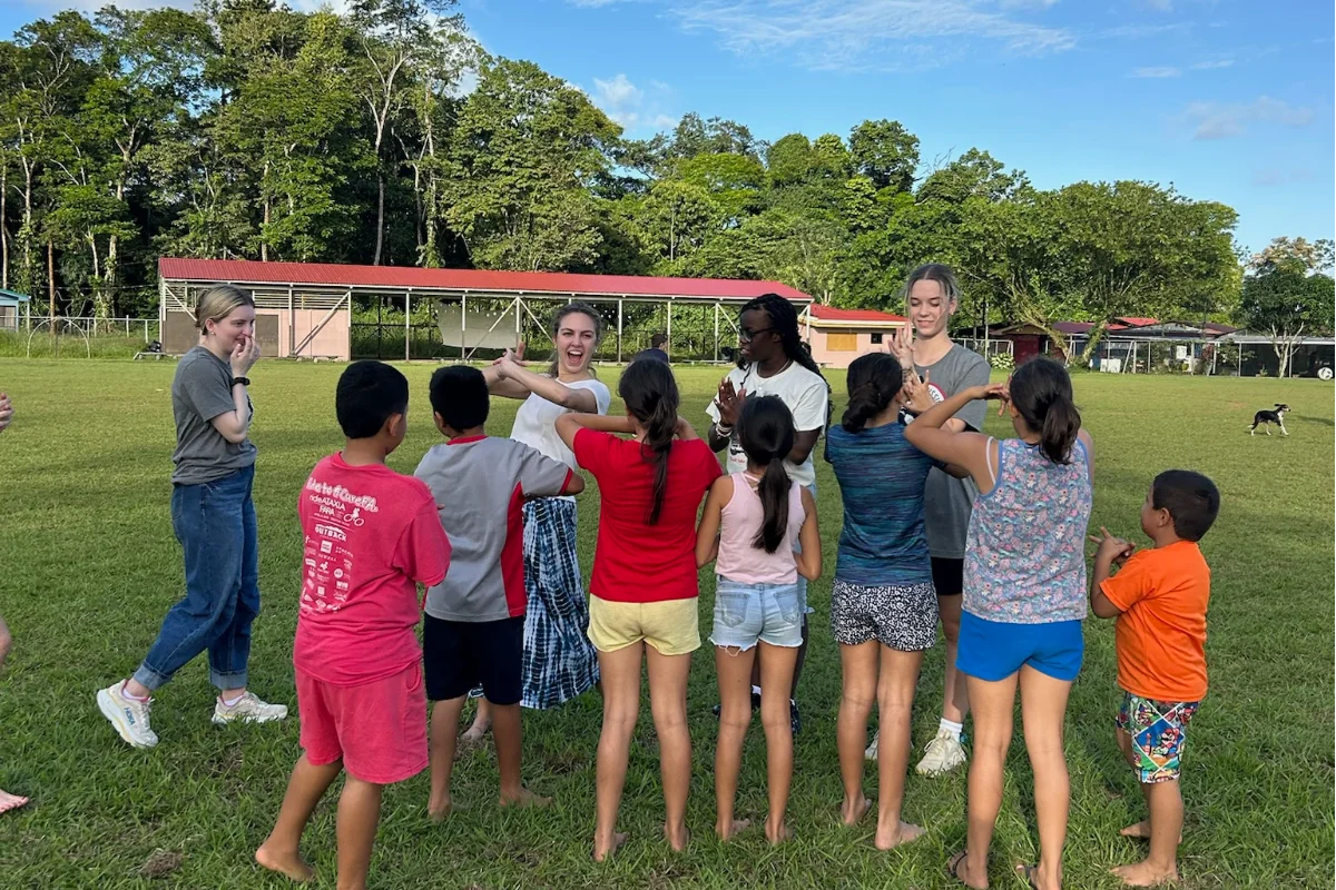 A big group of students smiling at the camera