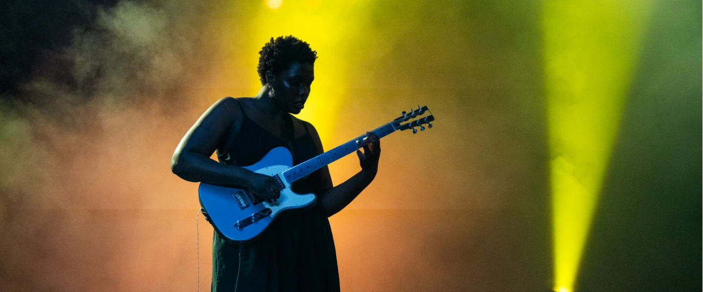 Woman playing an electric guitar