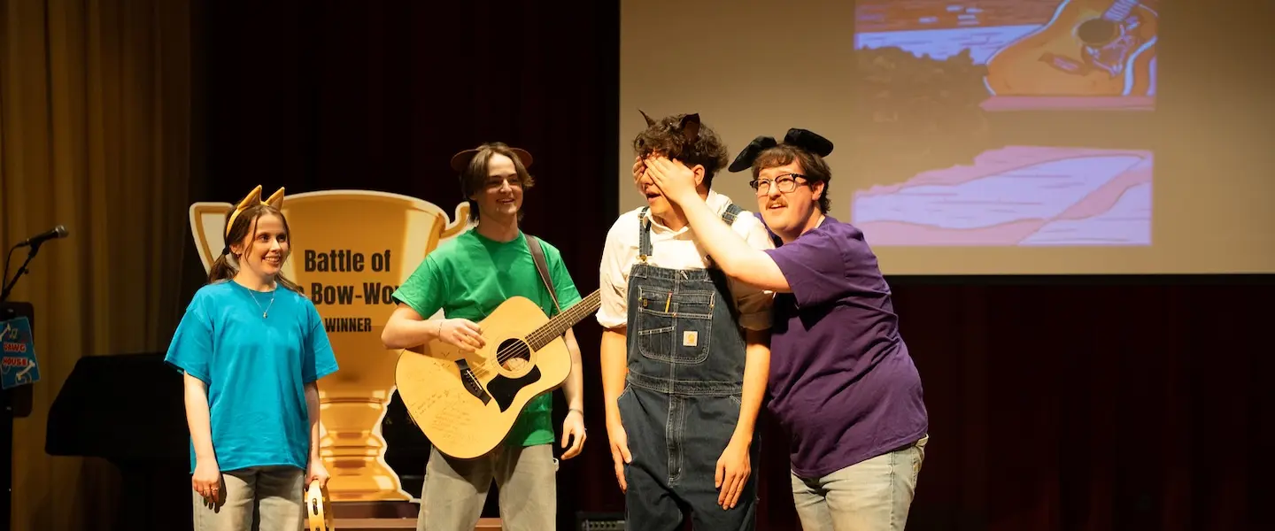 students performing on stage