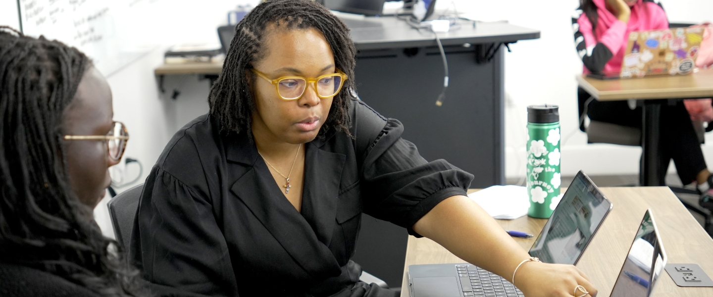 Heather Finch instructing a student in English class