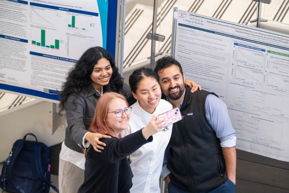 Thomas F. Frist, Jr. College of Medicine students smile for a photo as they celebrate the 2026 Research Symposium. 