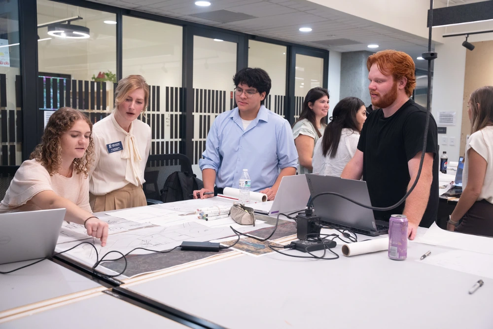 Winning team works on their design