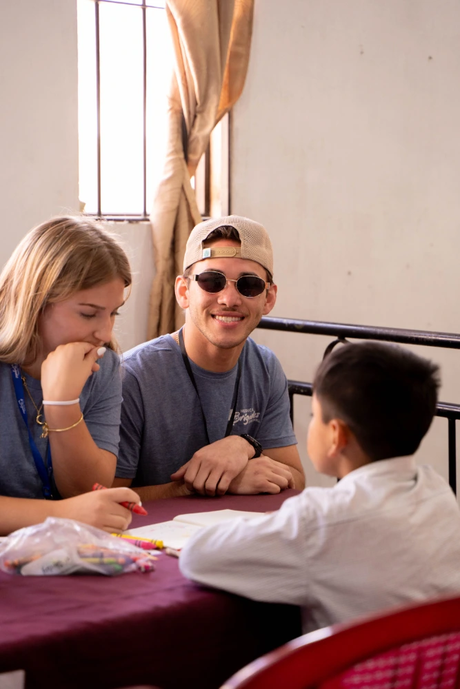 Volunteers giving educational lessons to children during the clinic