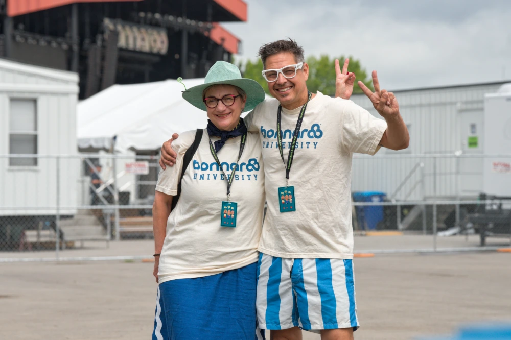 two smiling music festival attendees