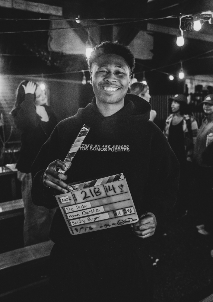 Black and white image of Kelvin Chambliss on a film set
