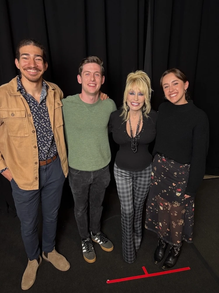Parton with students during the making of the musical