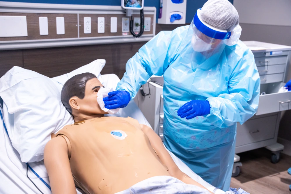 A med student tends to a high-fidelity mannequin