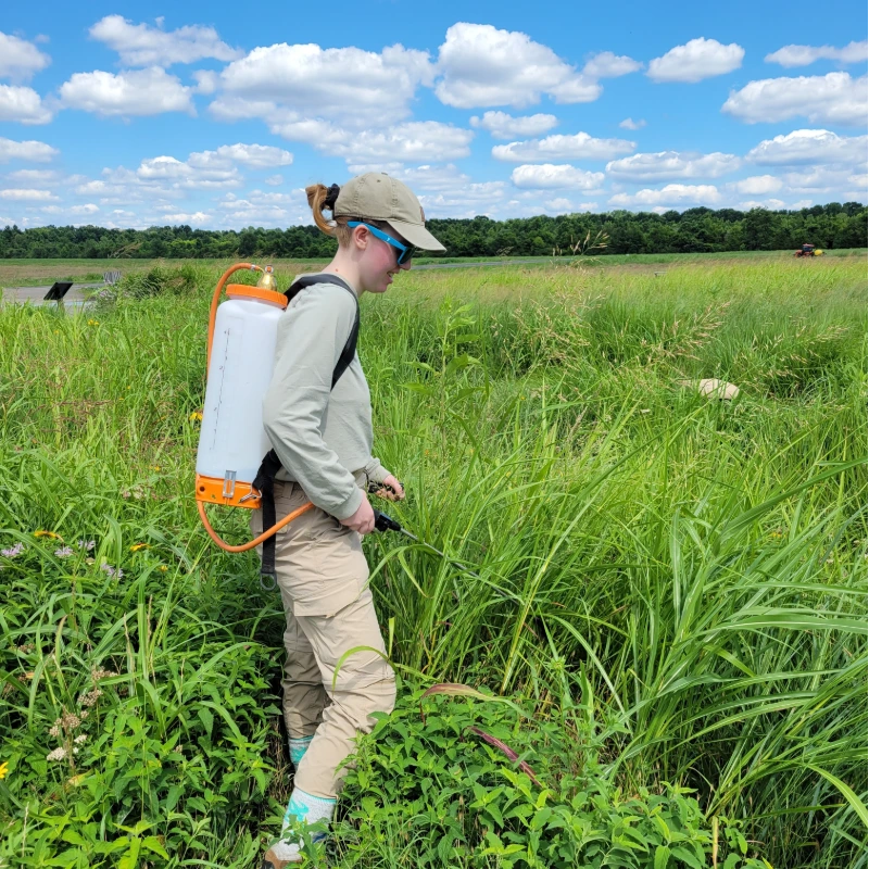 Todd Hoskinson, spraying herbicide for his internship