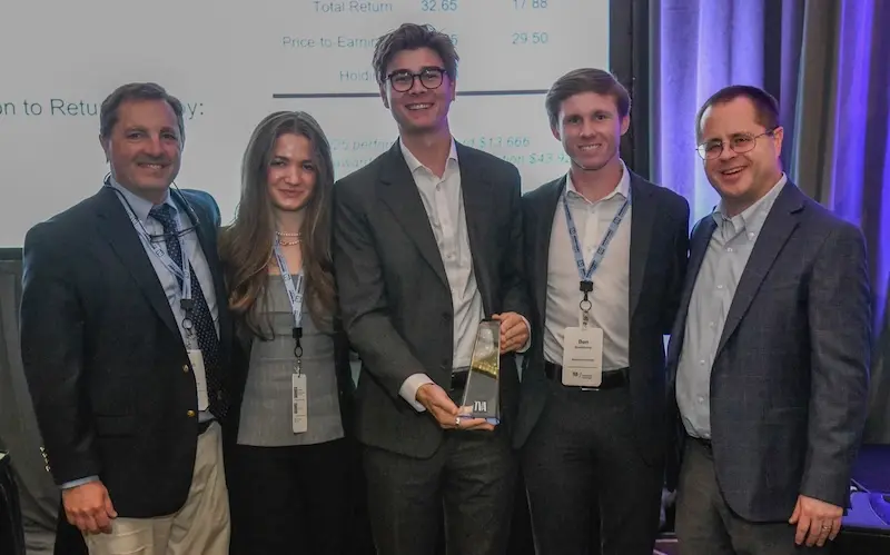 Massey students and faculty with award