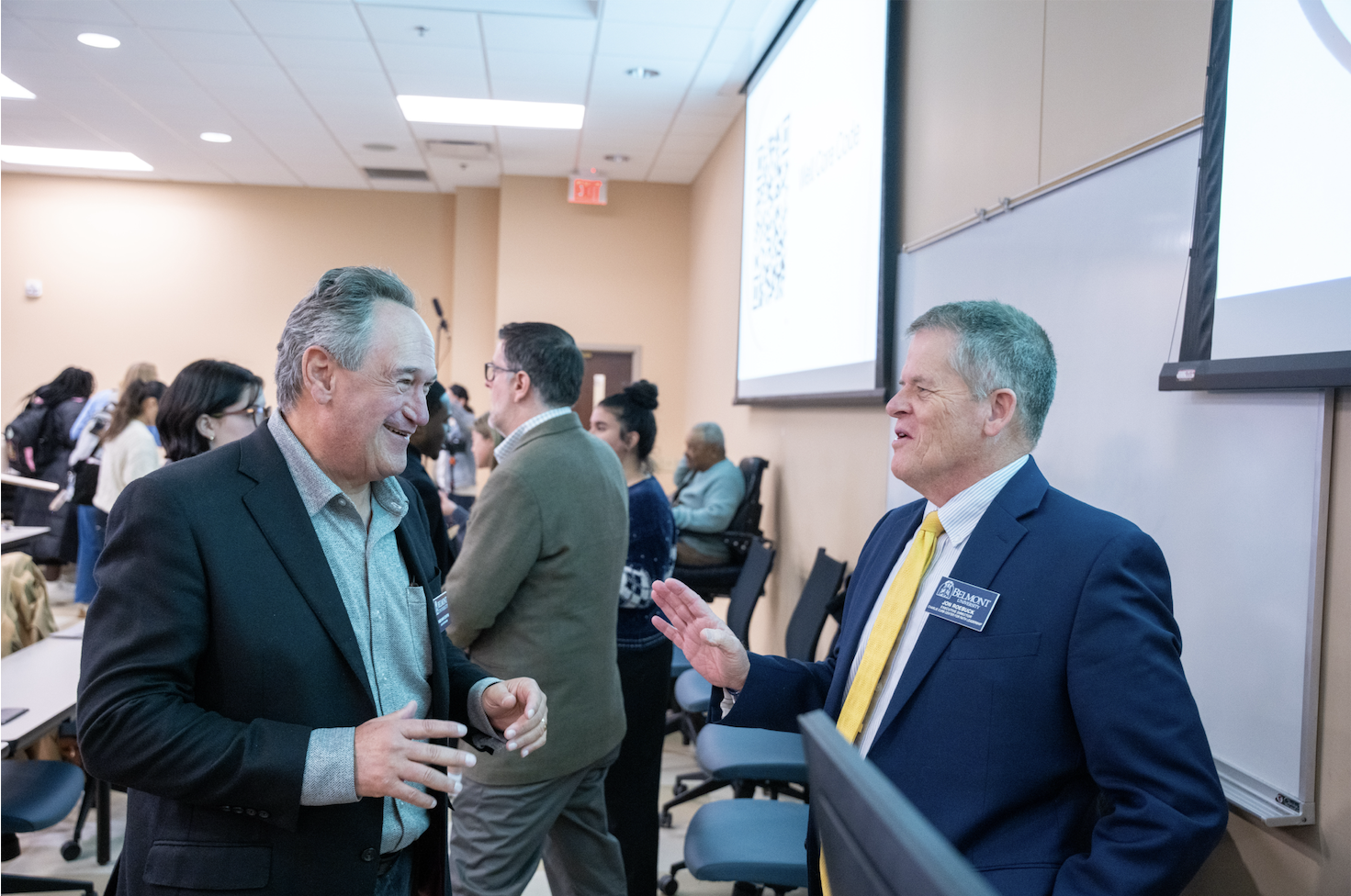 members of the panel socializing afterwards