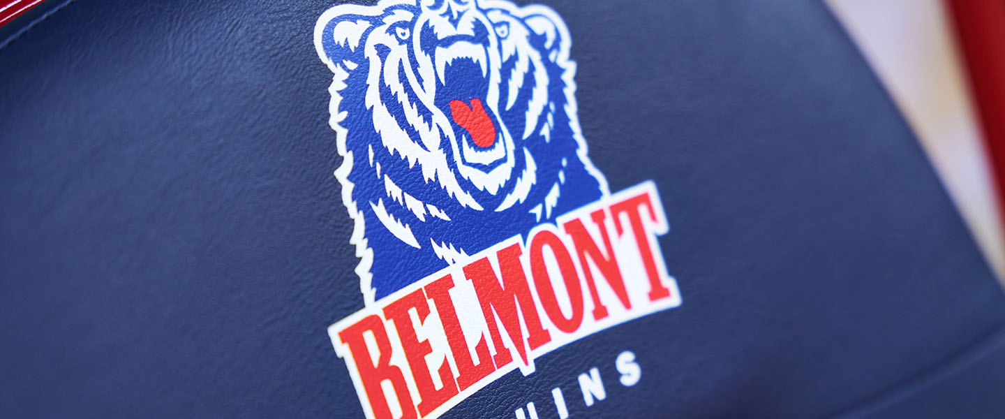 Close-up of the Belmont Bruins logo featuring a roaring bear, printed on a blue background.